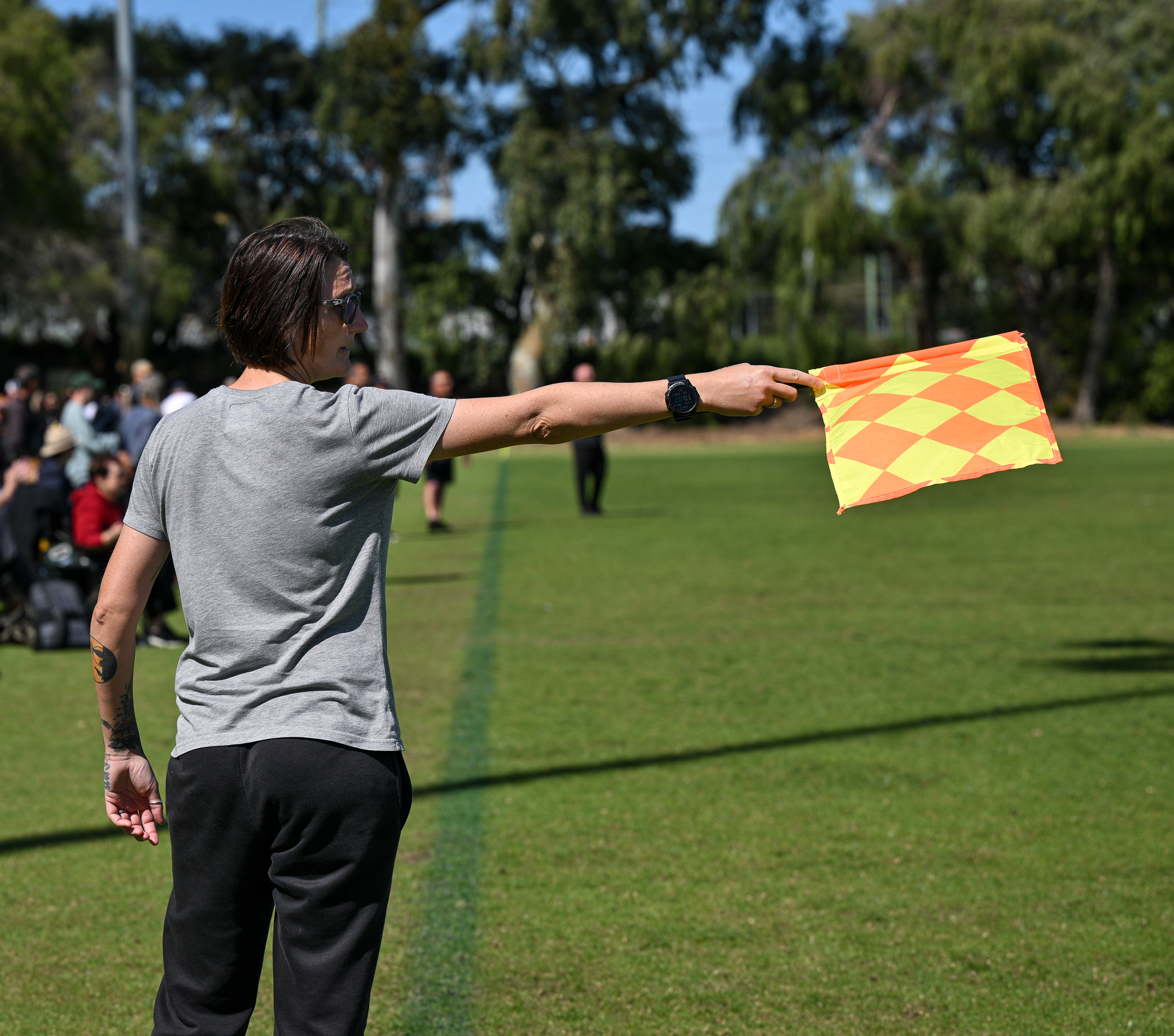 person holding offside flag